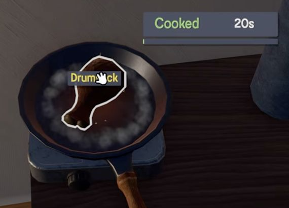 Drumstick in a pan with a green Cooked label